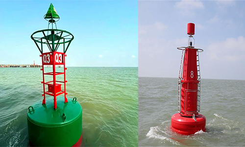 Solar Buoy Light YFFY Lights Two navigation buoys in the sea a green buoy with a red framework and 03 markings on the left and a tall red buoy with a light on top on the right