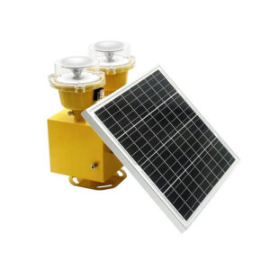 Yellow dual-bell solar-powered alarm siren with a small solar panel resting nearby.